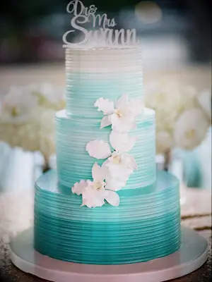 Aqua blue ombré beach-themed wedding cake