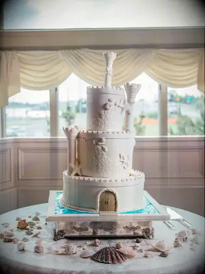 Sandcastle-inspired beach-themed wedding cake