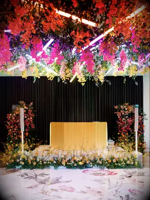 A gorgeous floral and neon wedding ceremony and reception space