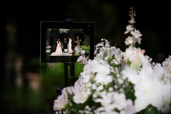 Livestream video on tablet during wedding ceremony