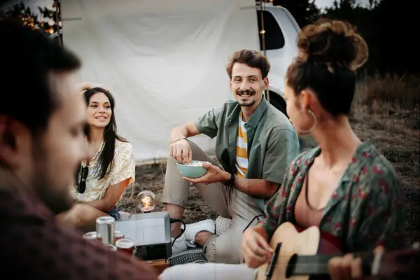 Two couples sharing a camping trip