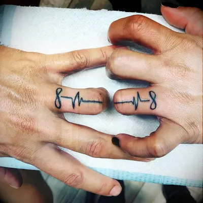 Infinity symbol and heartbeat tattoos