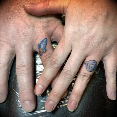 Moon and rocket ship tattoo