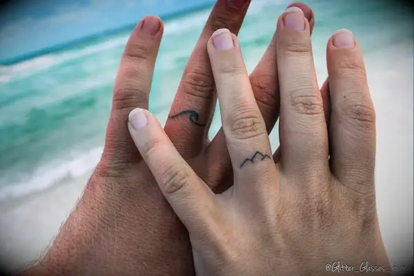 Wave and mountain tattoo