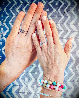 Matching waves tattoos