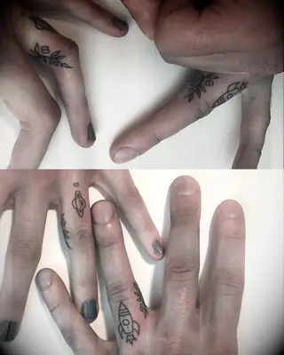 Olive branch and rocket ship tattoos