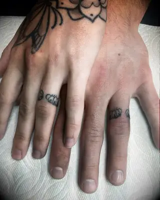 Matching insect tattoos