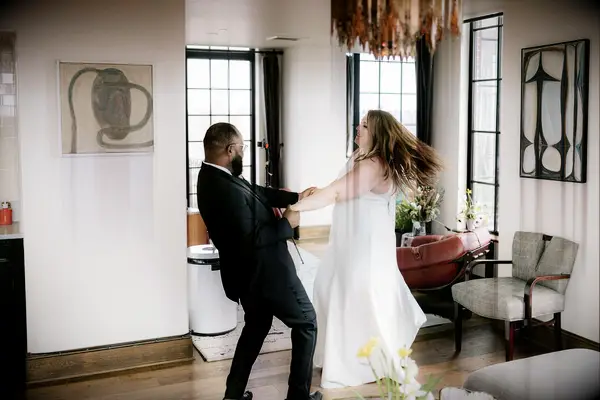 Cute Couple Poses: Couple twirls each other around. 