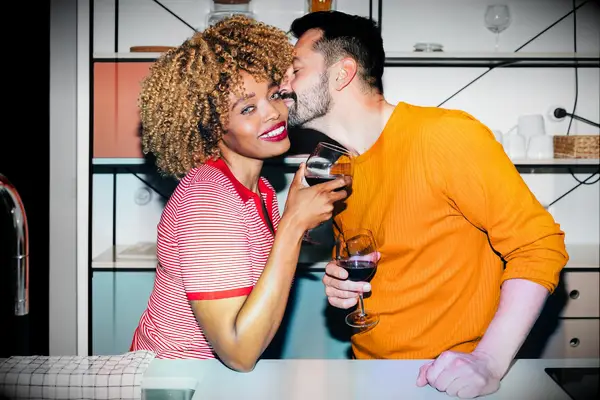 Cute Couple Poses: Man kissing woman on the cheek