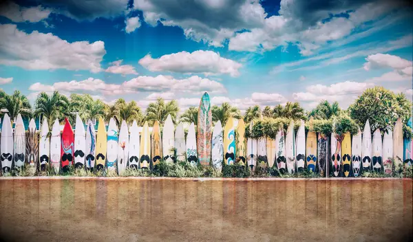 hawaii instagram captions - surf boards in a row on a beach