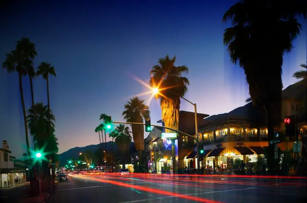 Palm Springs Bachelorette Party Nightlife - Restaurants and shops along N Palm Canyon Drive at dusk.
