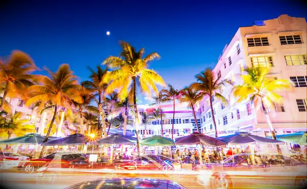 Cars speed down Ocean Drive