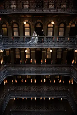Melani Lust for The Beekman couple poses in the atrium nyc beekman hotel