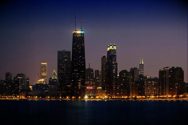 chicago skyline twinkles at dusk 
