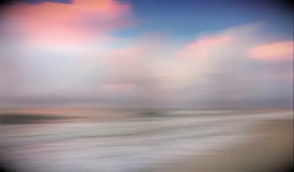 myrtle beach sunrise pink clouds and sand and blue skies and artistic interpretation of the atlantic ocean