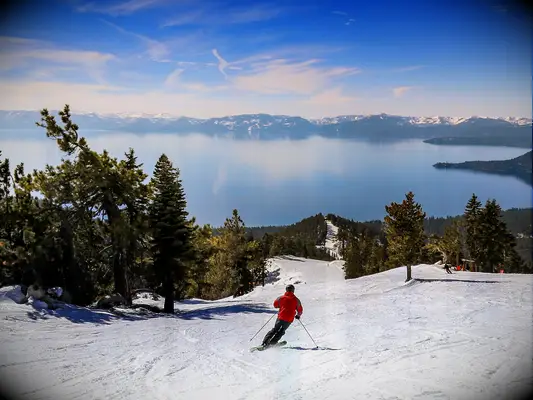 People skiing overlooking Lake Tahoe