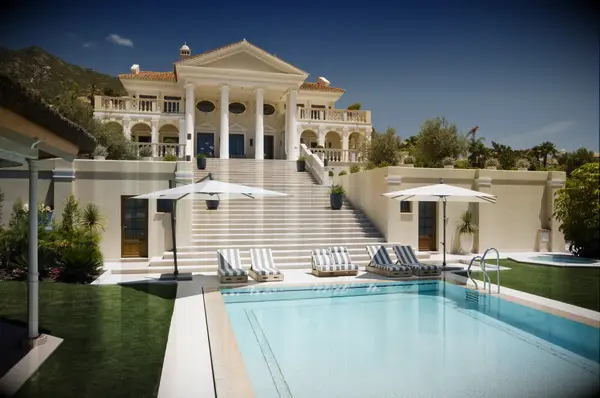 Luxurious Spanish villa perched on a hillside with a private swimming pool. 