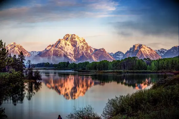 Grand Teton Mountains from Oxbow Bend on the Snake River at sunrise. Grand Teton National Park, Wyoming, USA