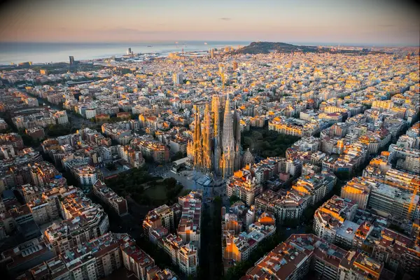 Barcelona City Skyline with Sagrada Familia Cathedral at sunrise. Catalonia, Spain. Aerial view 