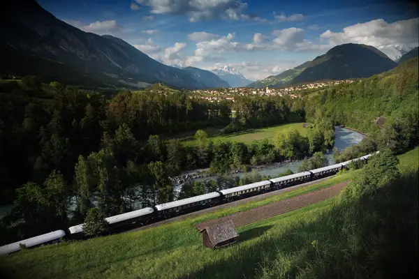 Train going by mountains 