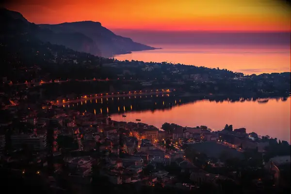View of sunrise over Villefranche sur mer with Saint Jean Cap Ferrat,Cote d Azur,South of France