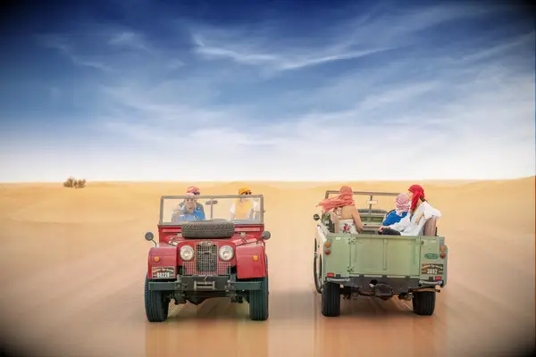 honeymoon outing in the middle east desert in throwback range rovers