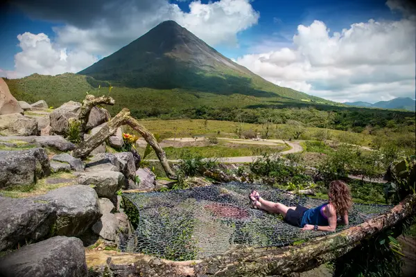 Person resting near Arenal Volcano in La Fortuna, Costa Rica