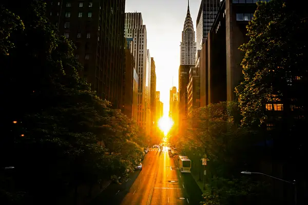 Sunset Captions for Famous Cities & Locations - The sun sets across the NYC cityscape