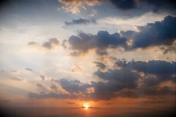 Short Sunset Captions and Hashtags - sun sets among the clouds