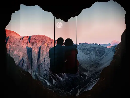 couple on swing in heart cave switzerland honeymoon advisor planner