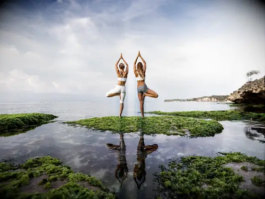 Women practicing yoga in Uluwatu