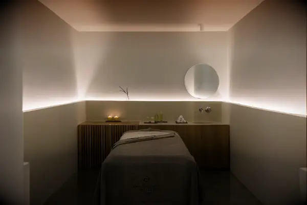 andronis arcadia spa treatment room dimly lit with wood accents private and quiet 